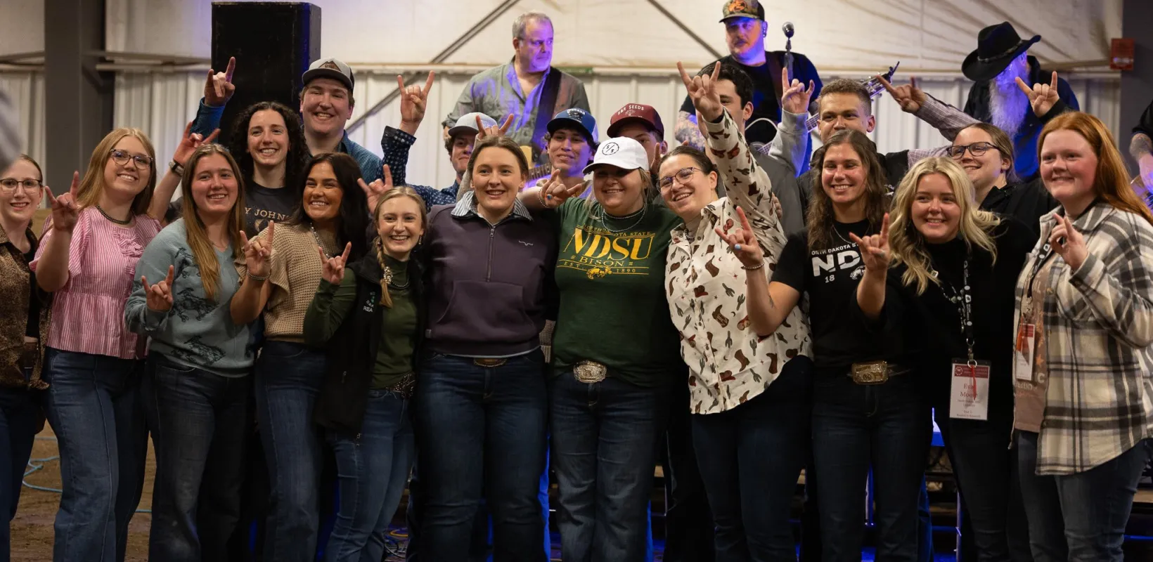 College of Ag students giving horns up symbol