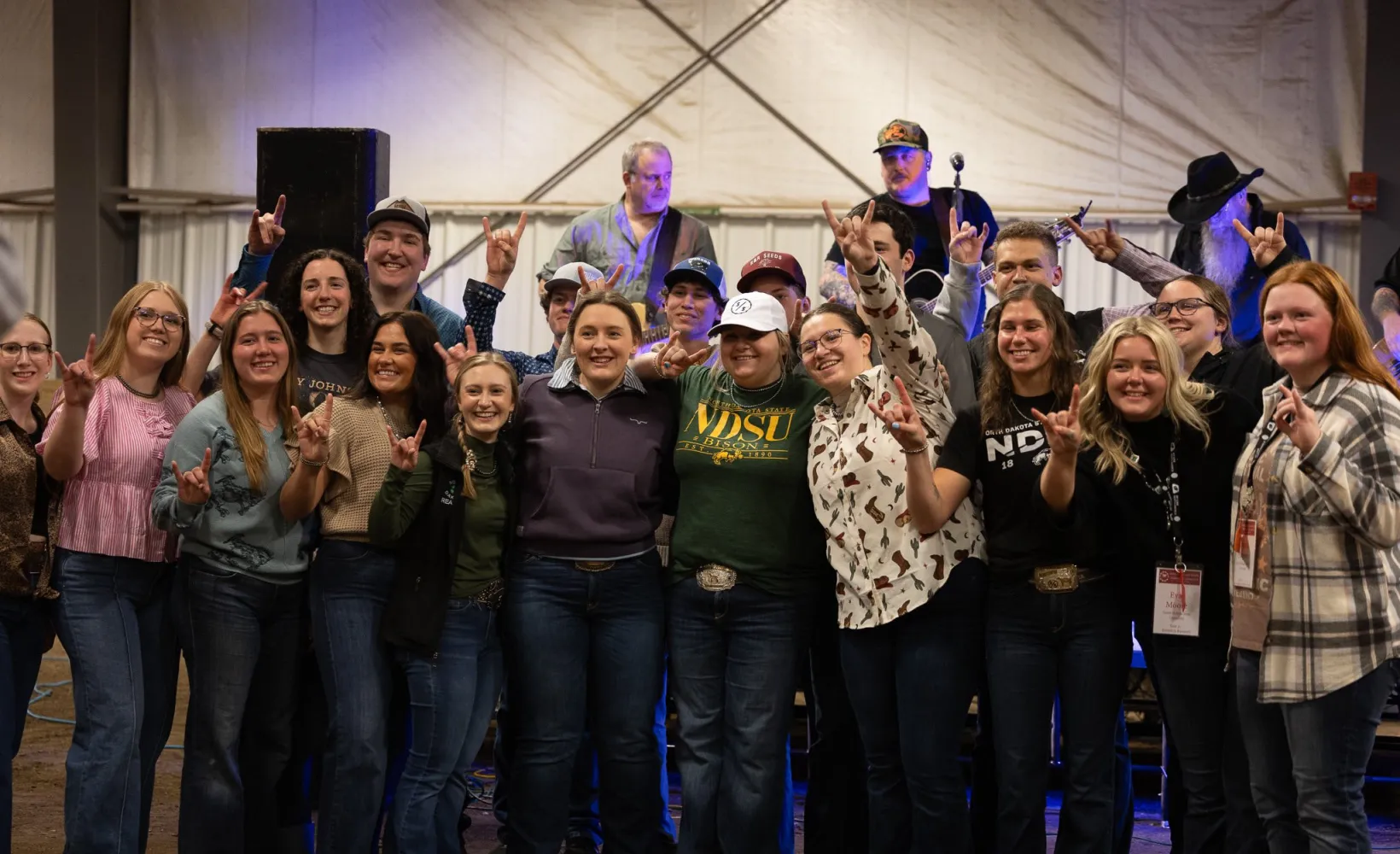 College of Ag students giving horns up symbol