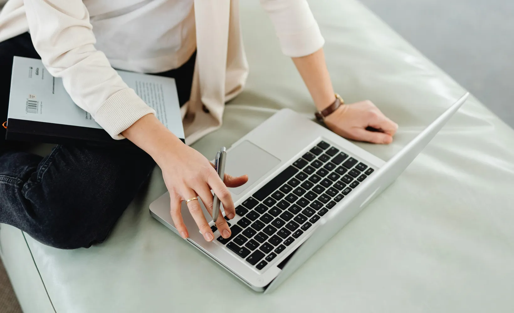 close up of student working on laptop