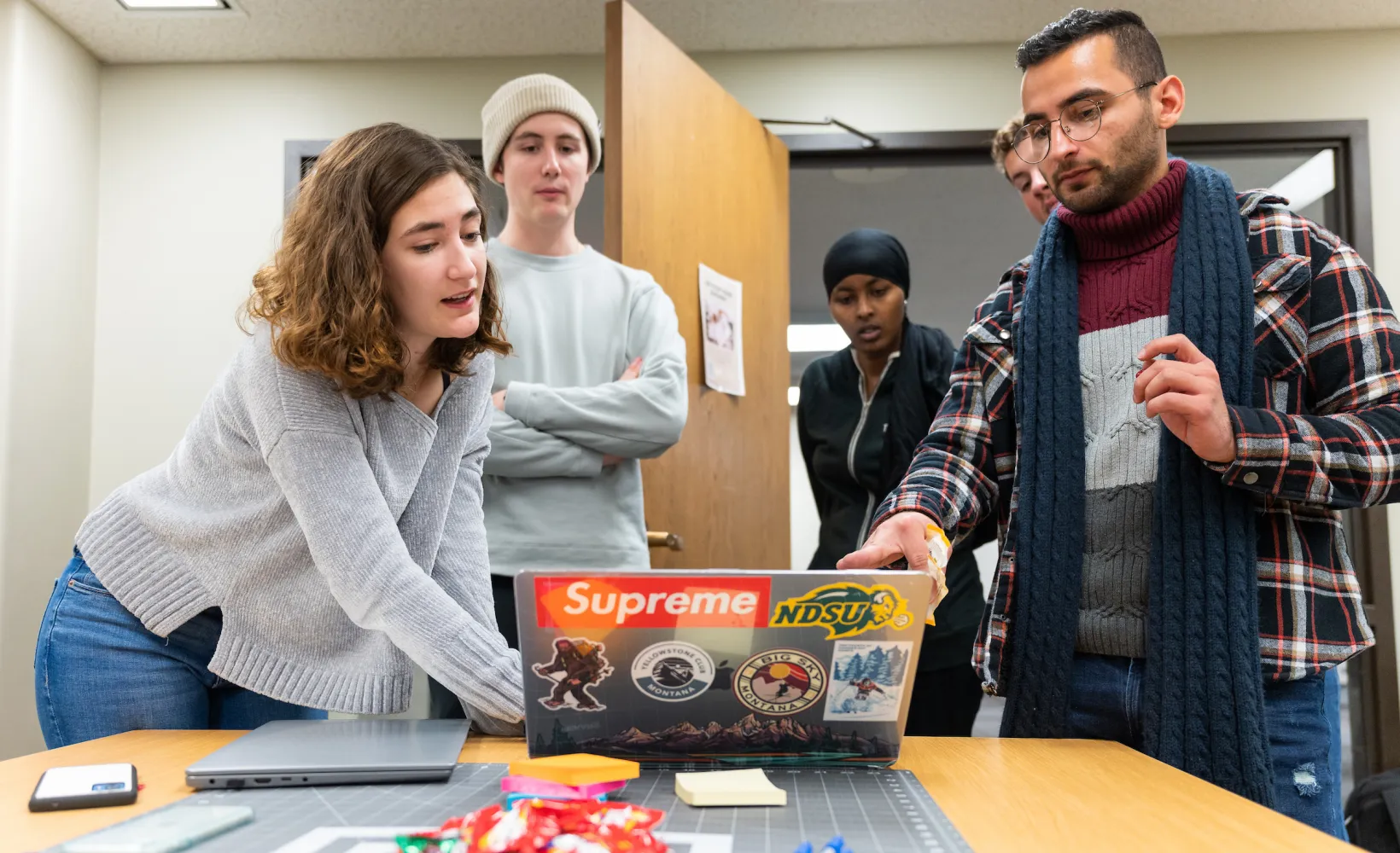 students work together on a project during class