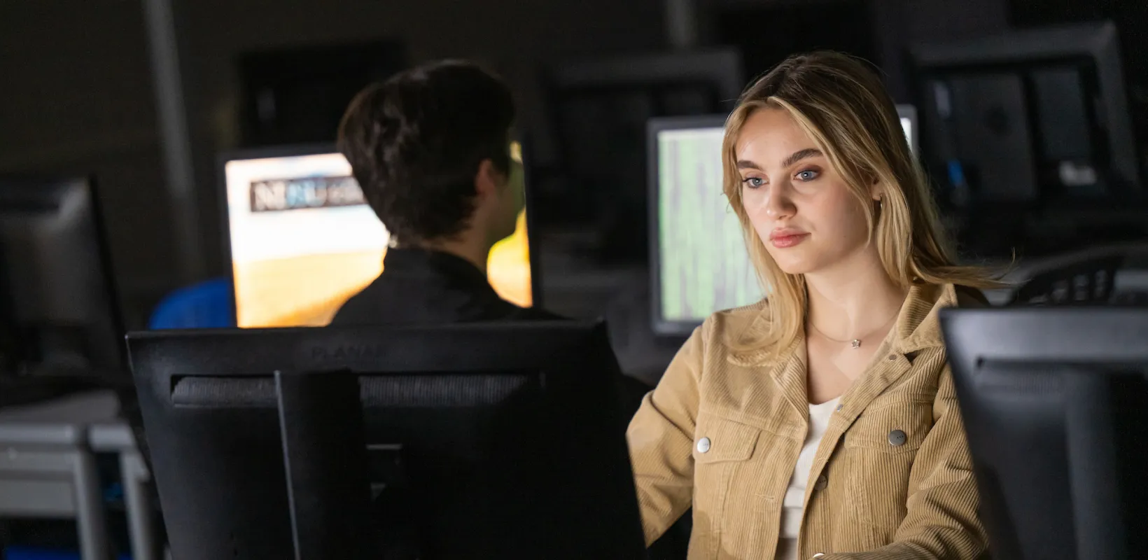female student at computer in a computer lab