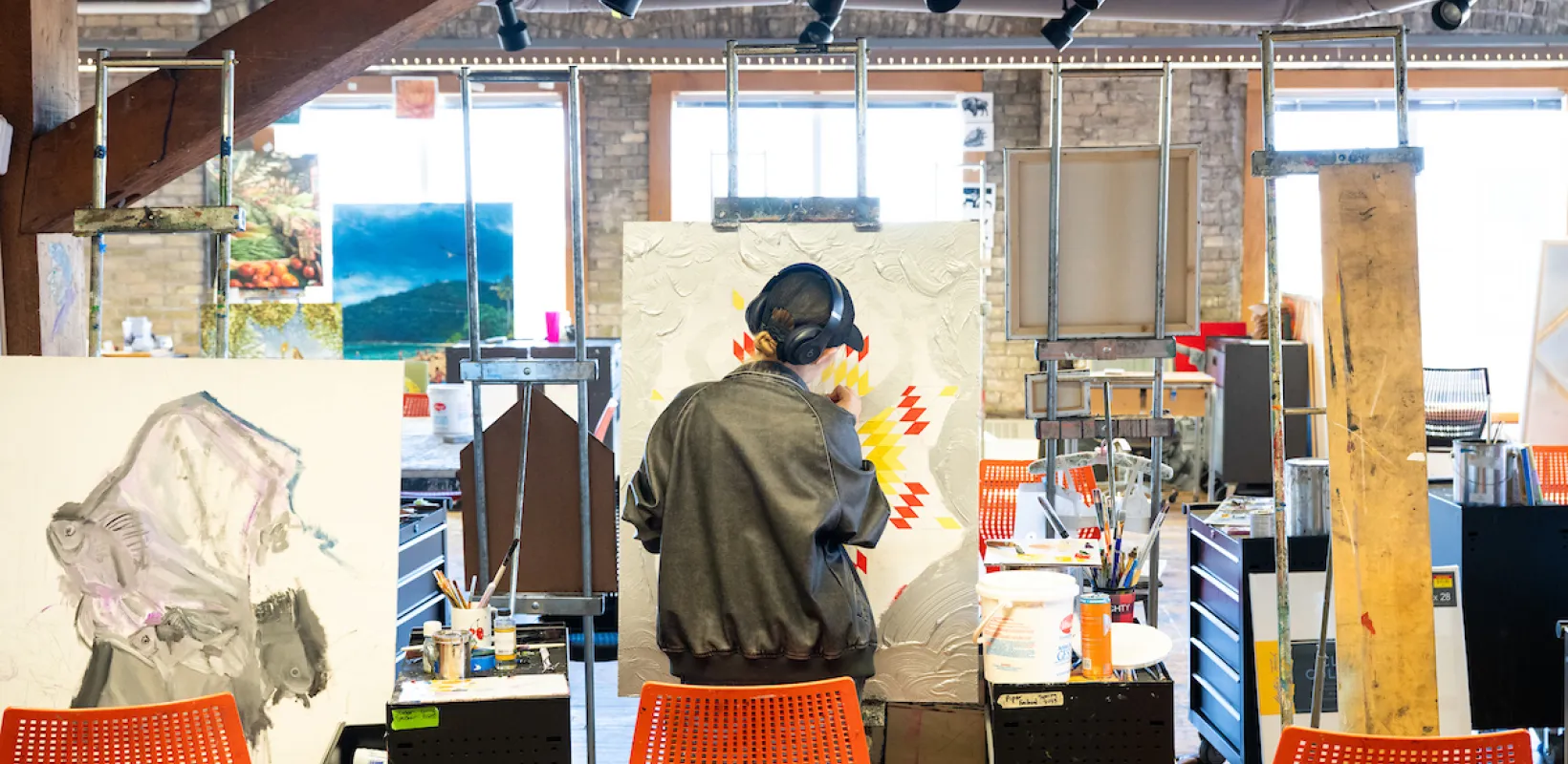 Art student working on project in art studio.