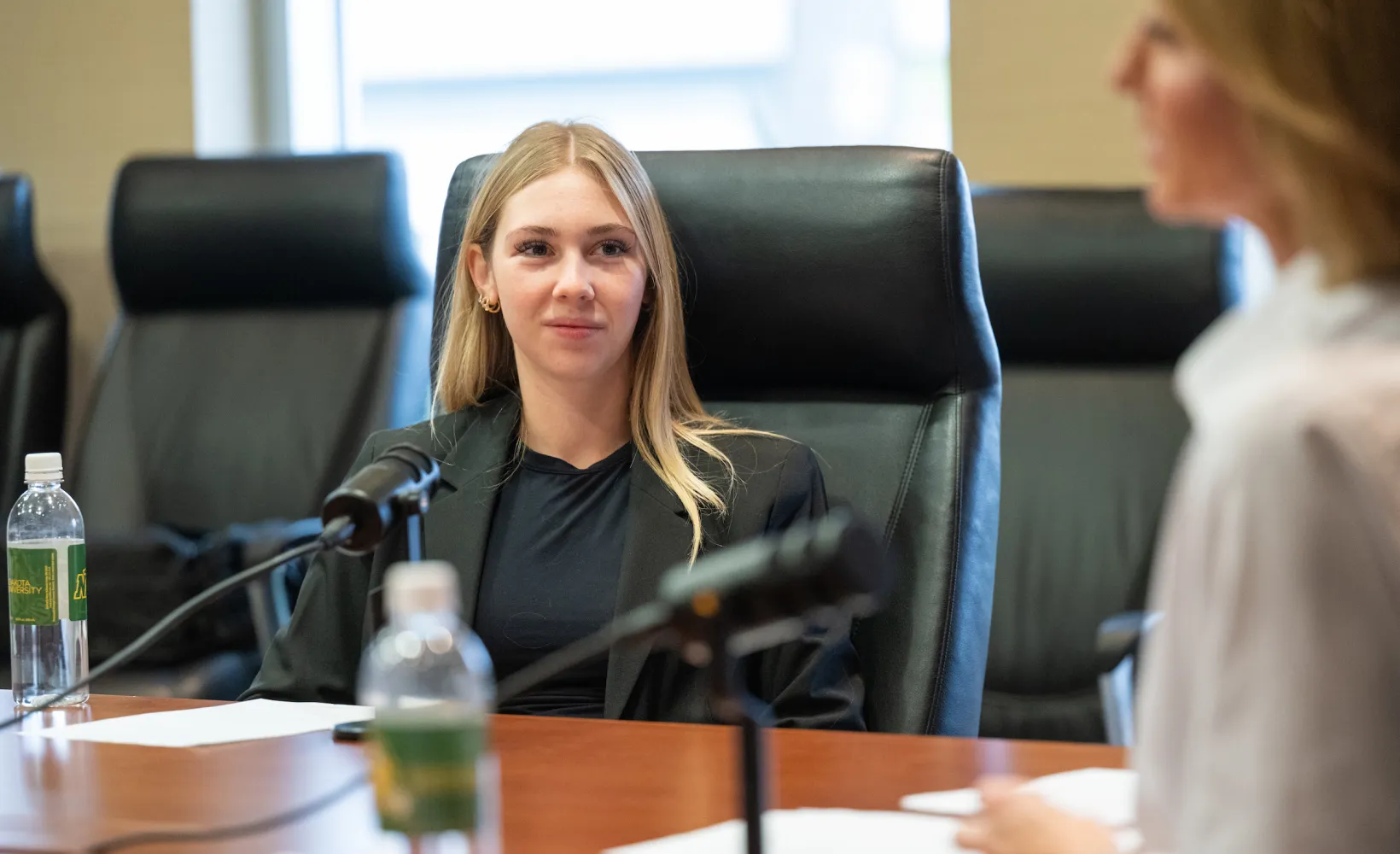 student interviewing an entrepreneur as part of a business podcast