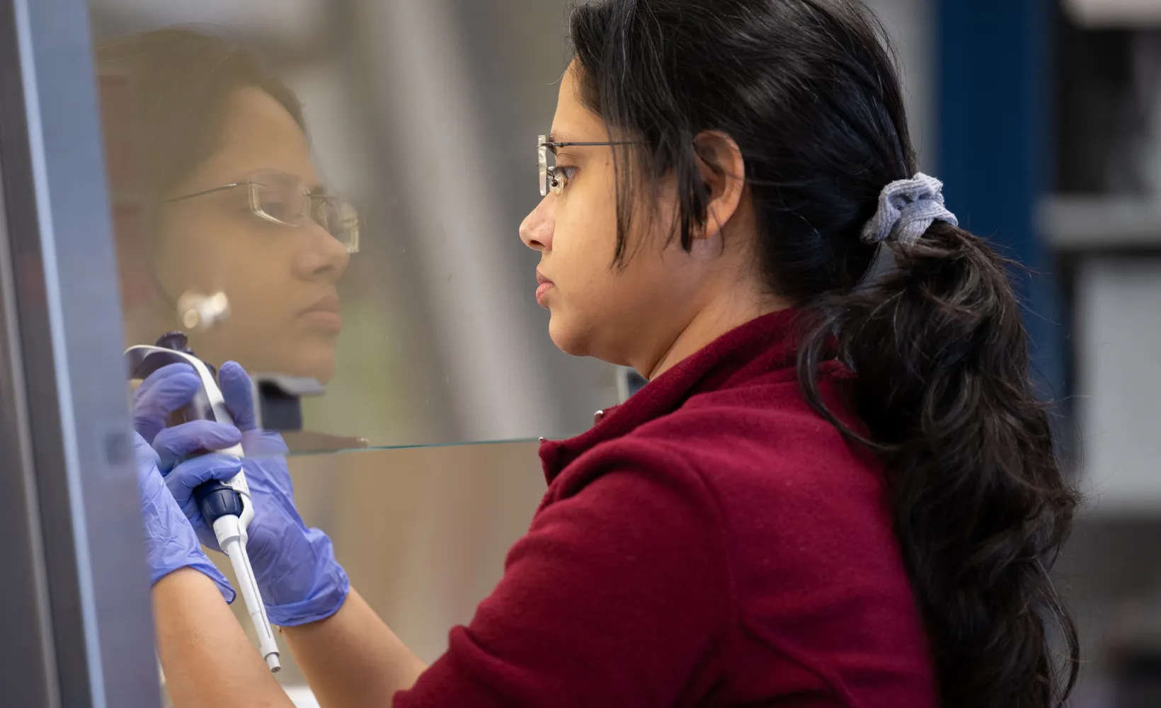 graduate Microbiology student works in a lab