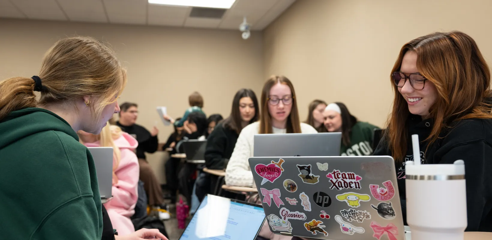Political Science students working on laptops during class