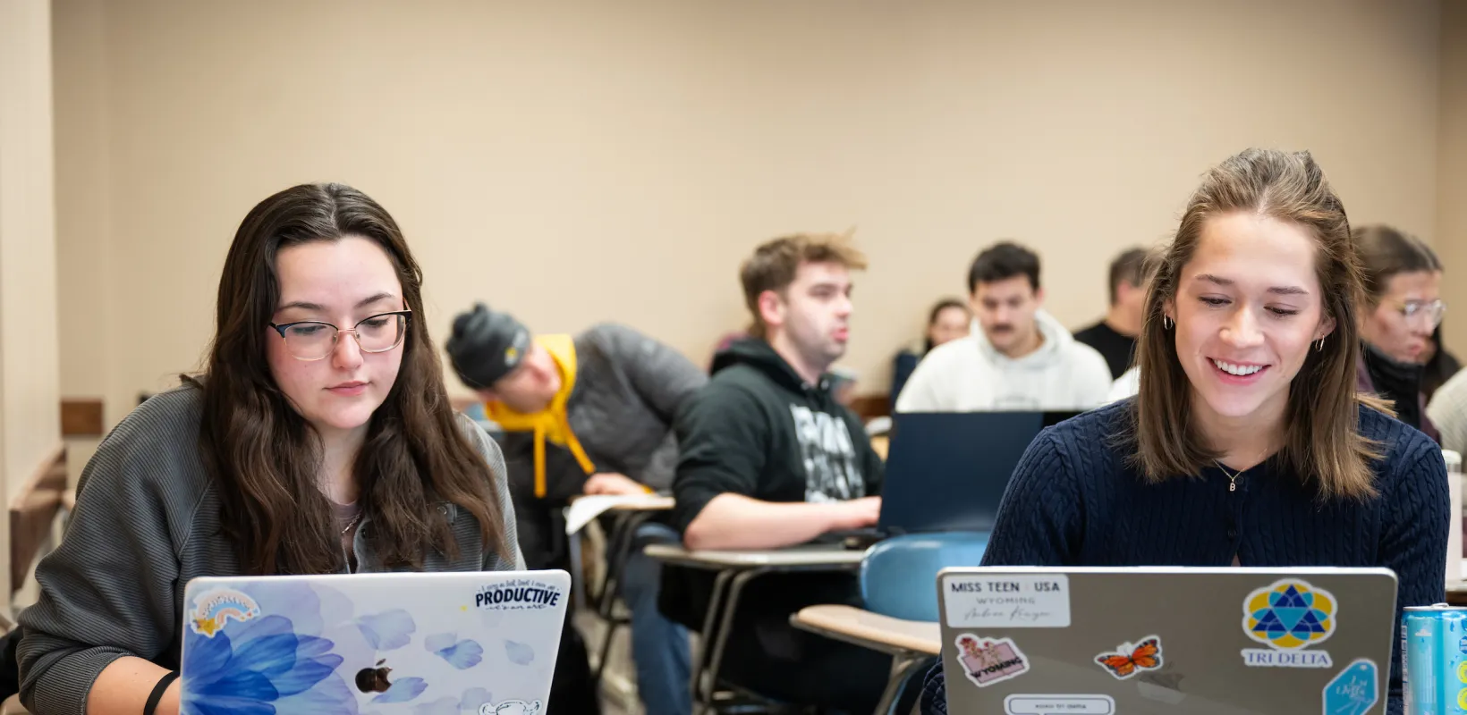Political Science students working on laptops during class