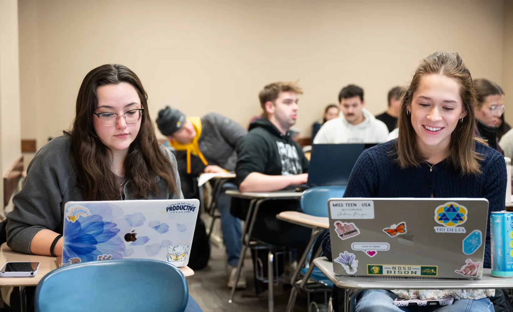 Political Science students working on laptops during class