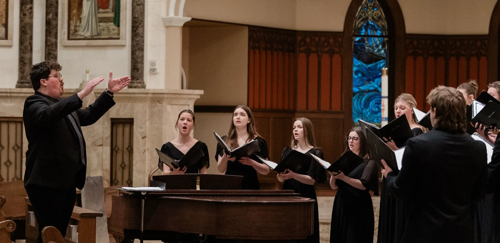 Music graduate student conducts a Concert Choir Concert