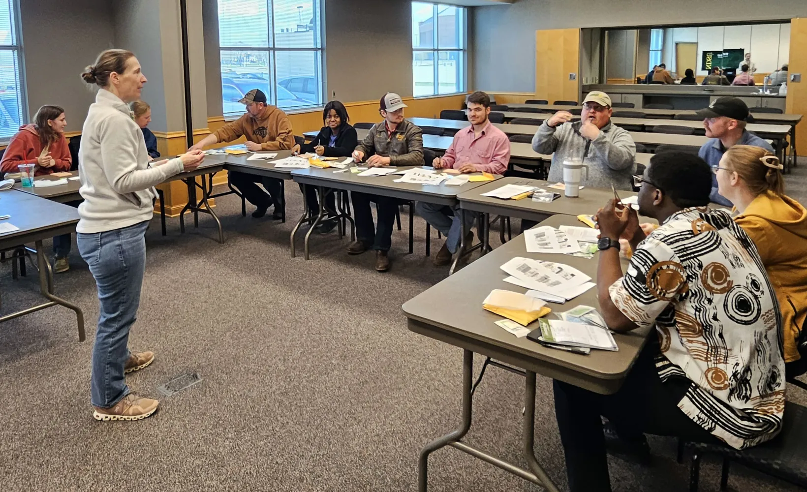 NDSU Attending Vet Dr. Pecoraro speaking to a group of people at a training session.