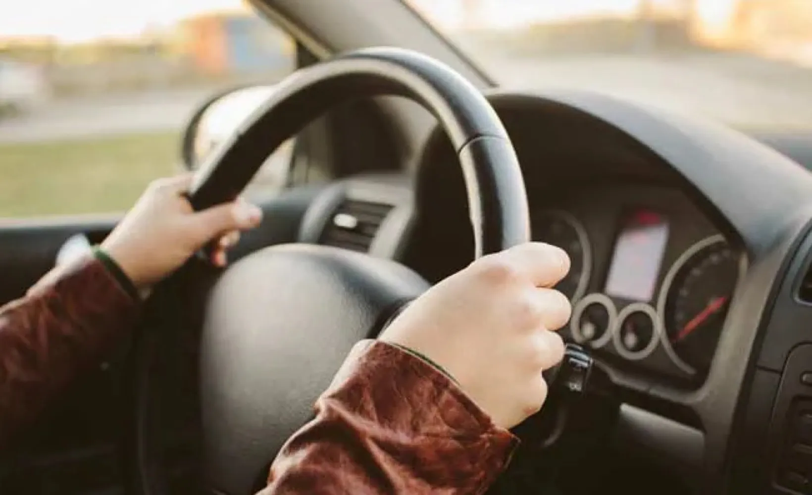 Hands on steering wheel