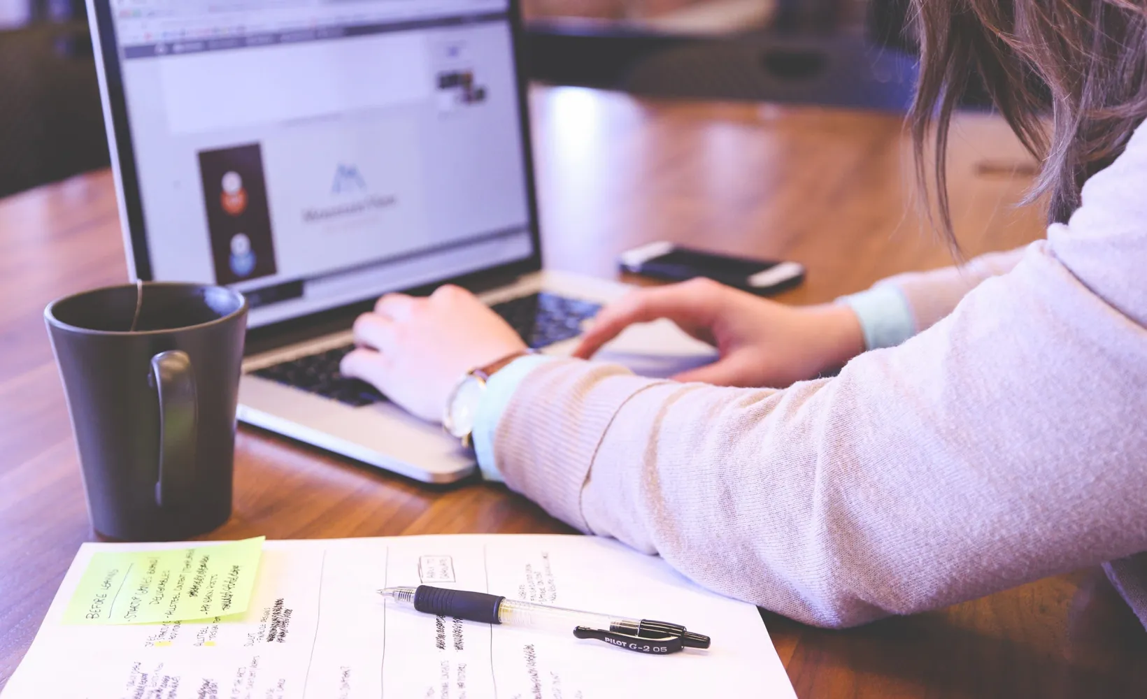 close up of someone working on a laptop