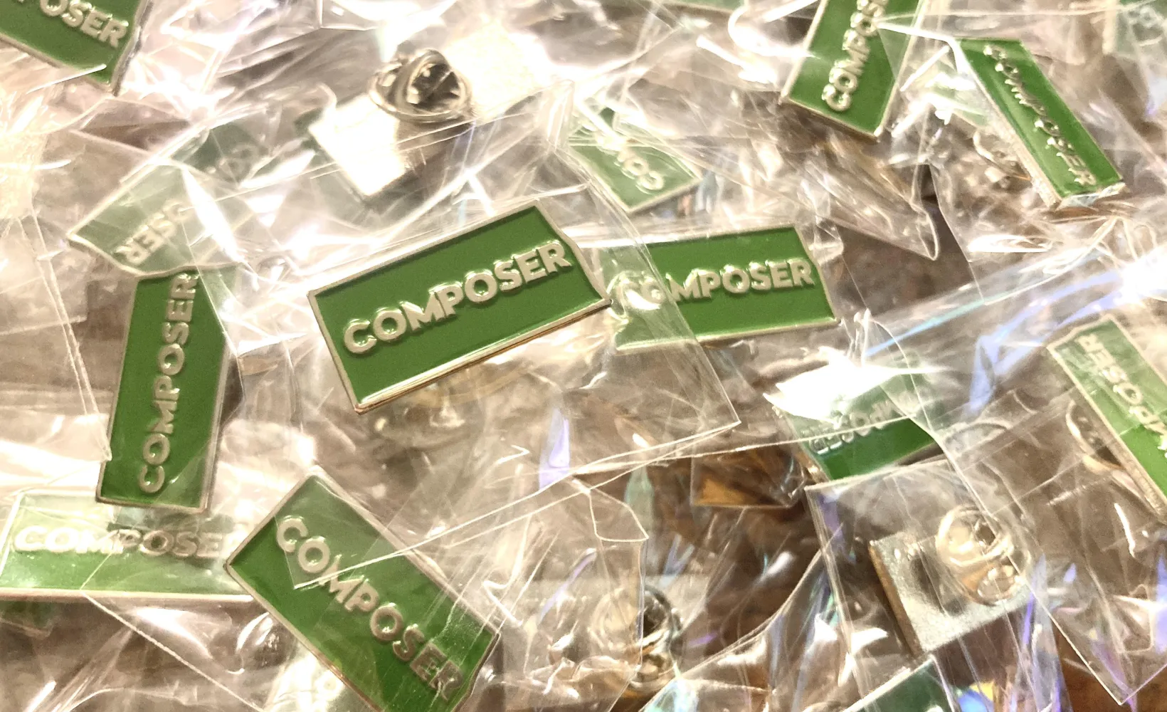 Dozens of composer pins in the shape of North Dakota