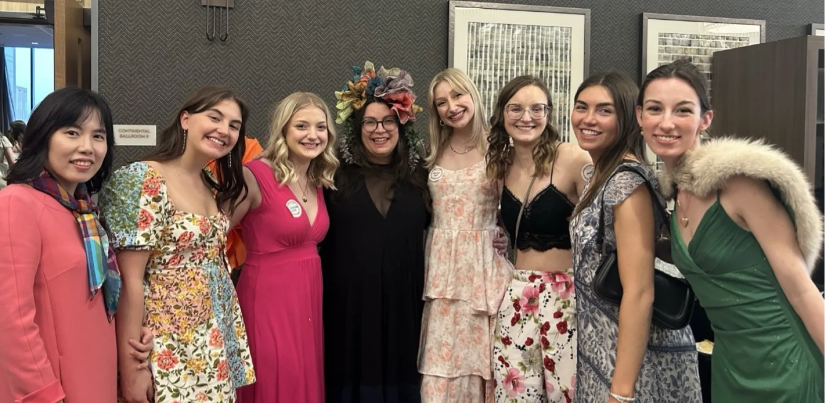 A group of NDSU students smiling confidently at camera.
