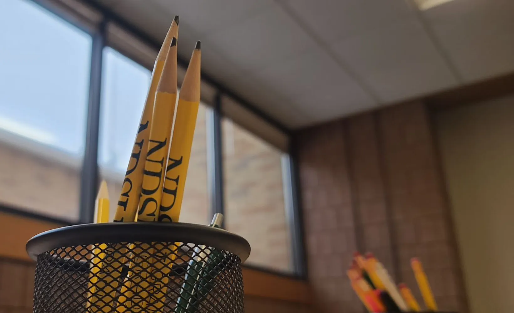 Center for writers desk, pencils in a cup