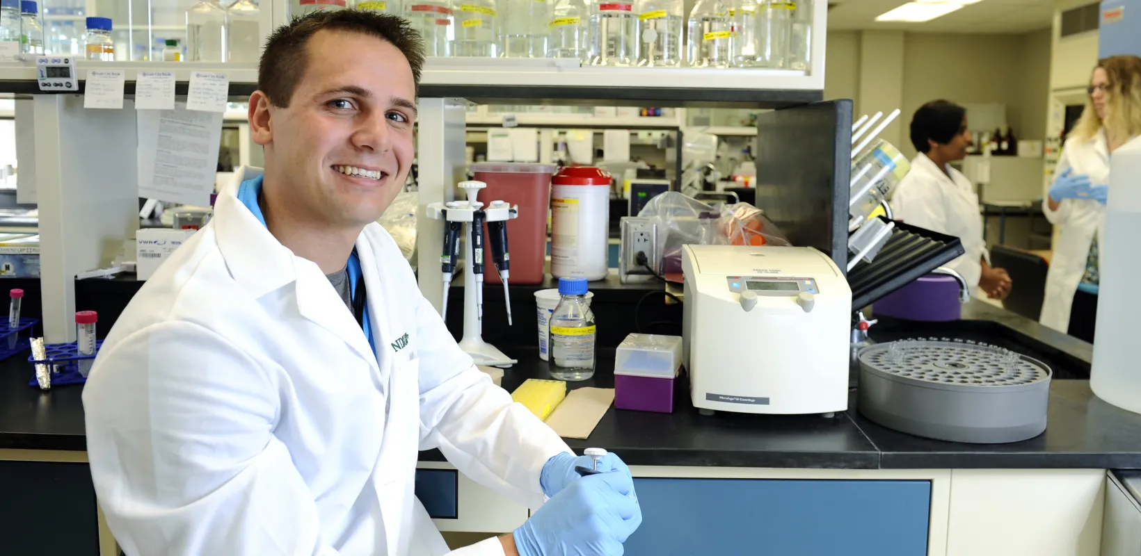 Postdoctoral Fellow smiling confidently to the camera