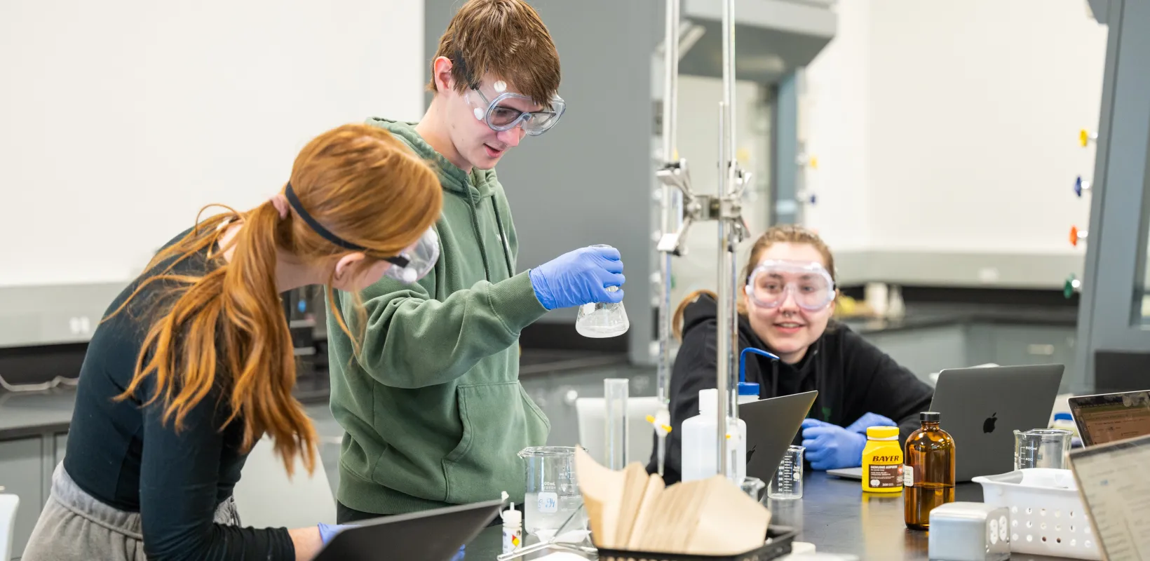 Student performing an experiment in lab