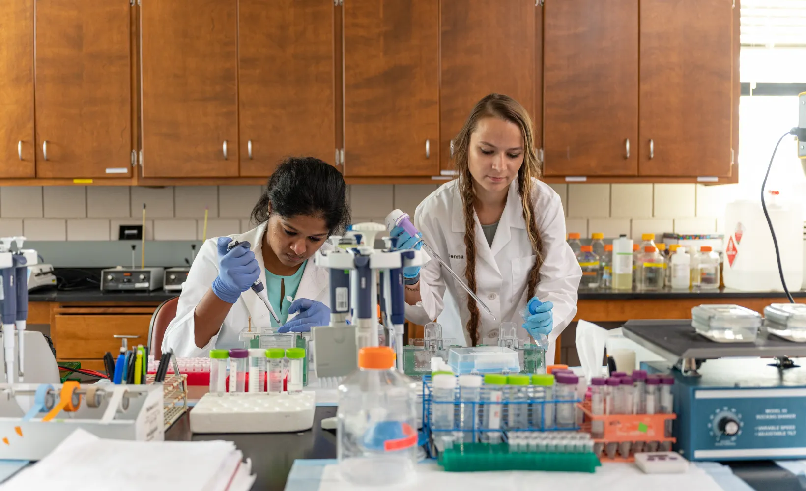 Student performing an experiment in lab