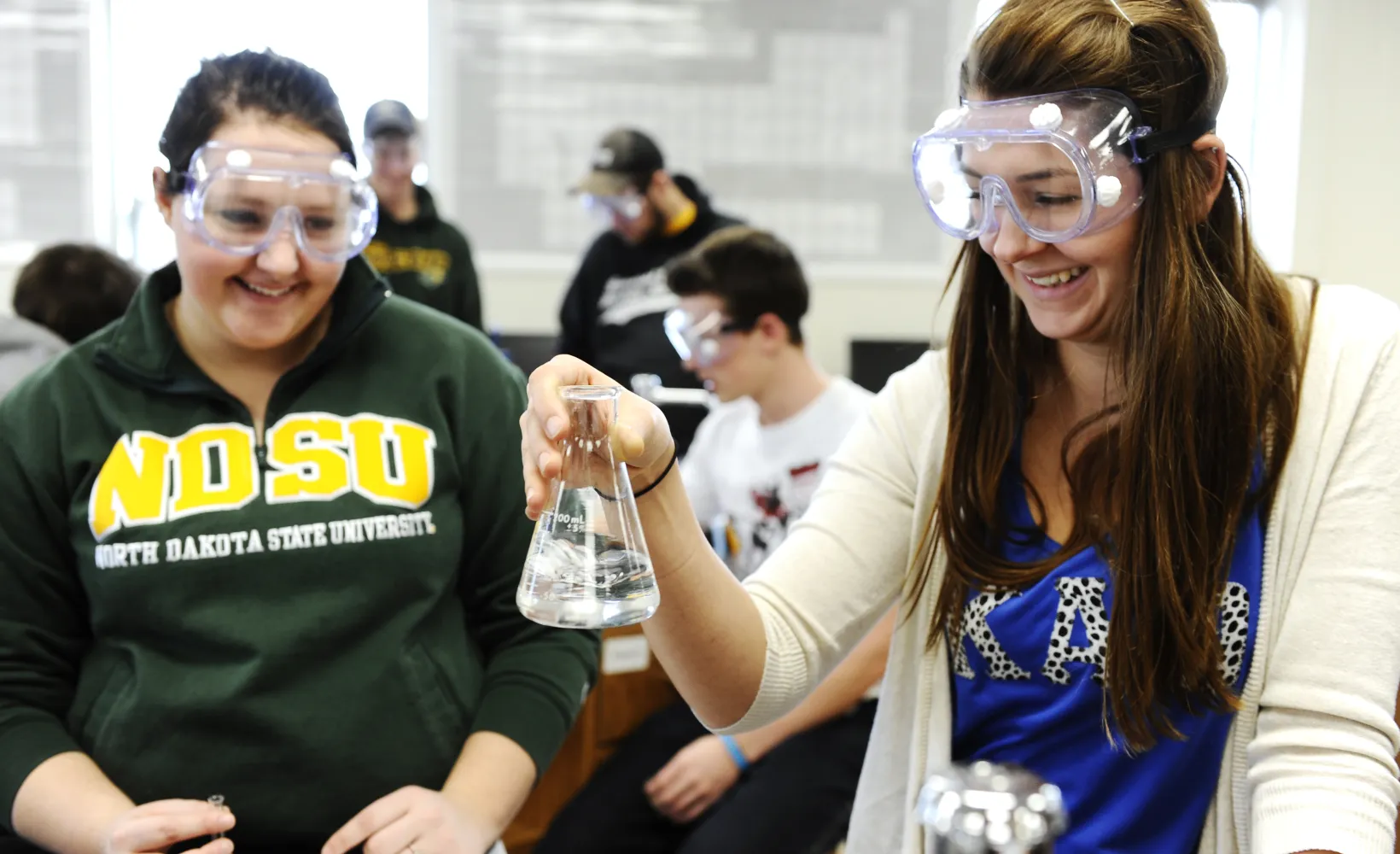 Students performing an experiment in lab