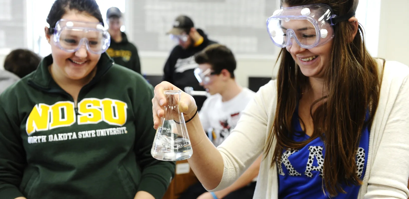 Students performing an experiment in lab