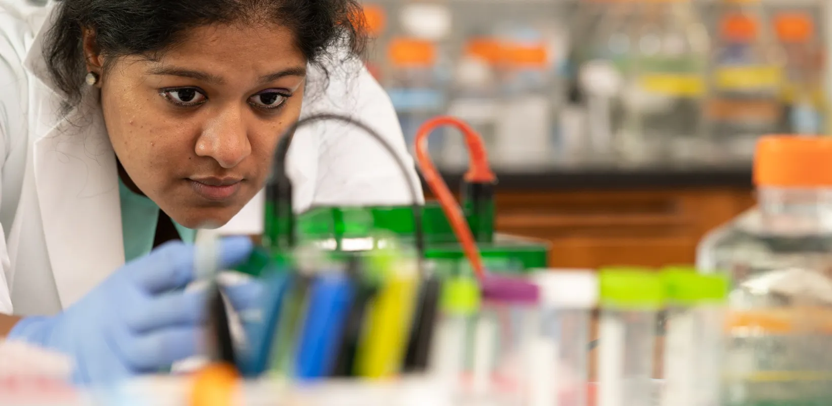 Student performing an experiment in lab
