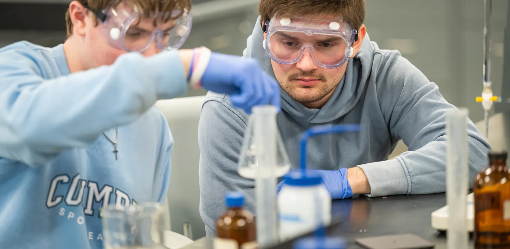 Student performing an experiment in lab