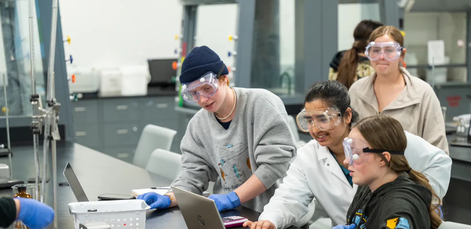 Students performing an experiment in lab.