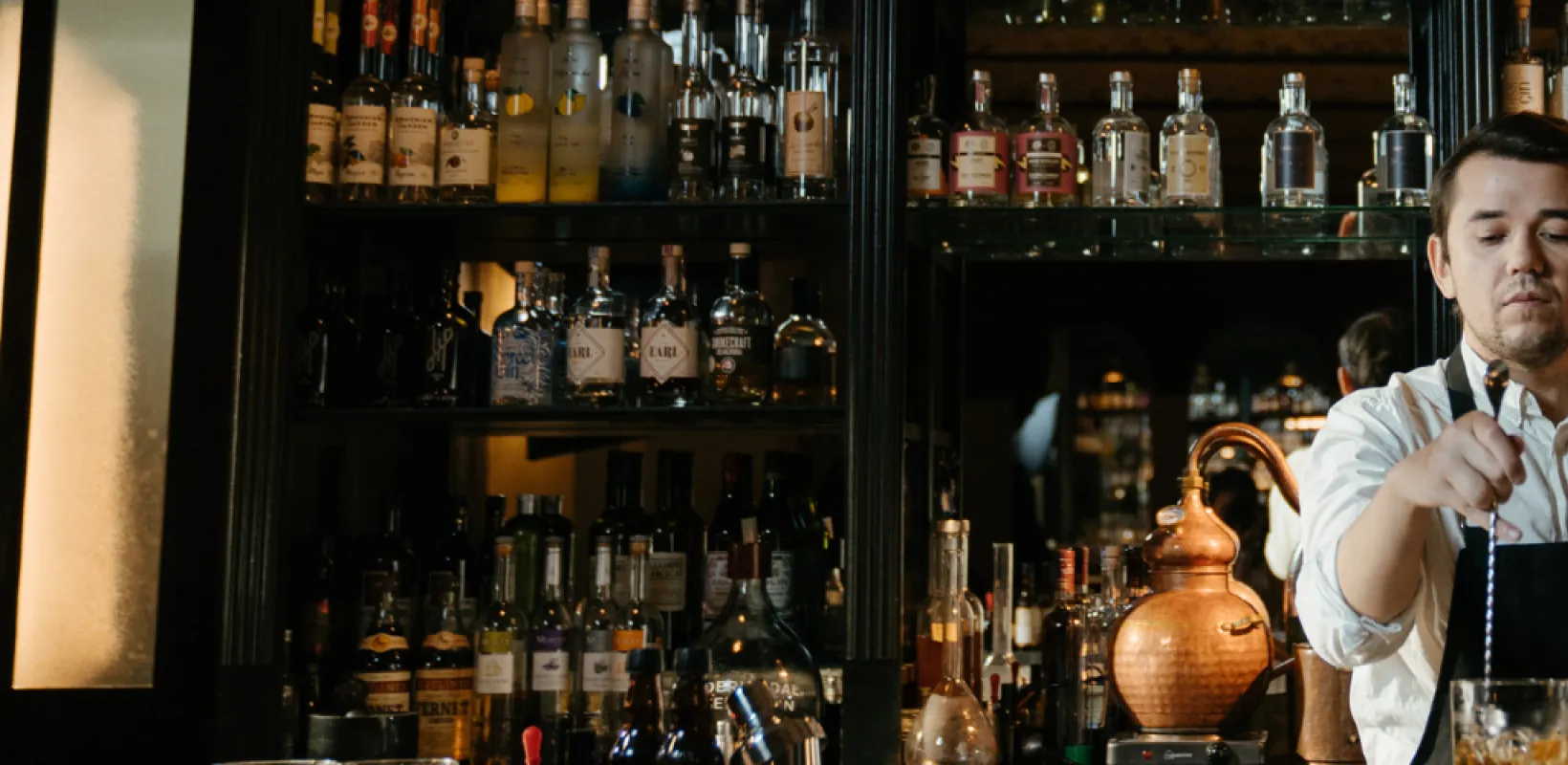 Man mixing a drink while bartending 