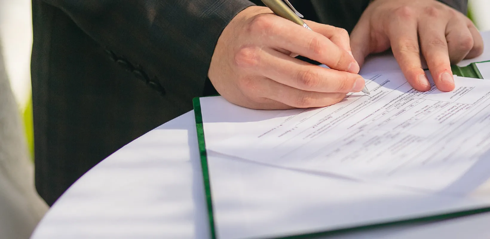 Person writing an insurance policy