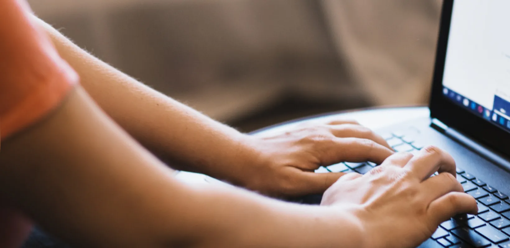 Person typing on a computer