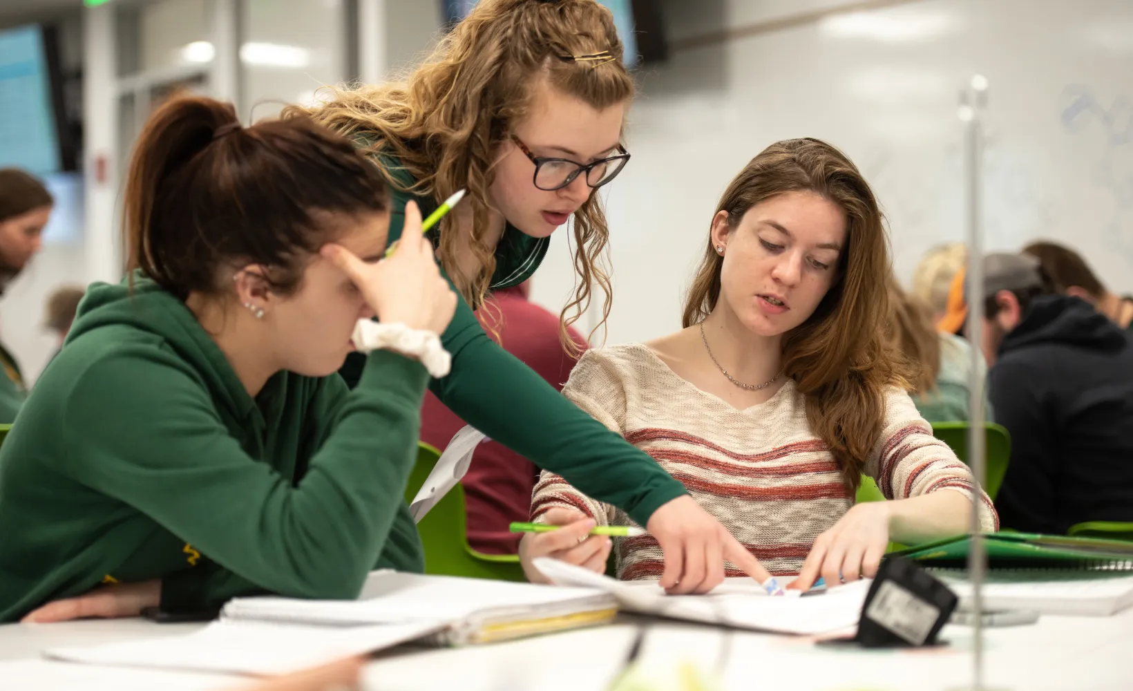 Students working together on an assignment in an active learning classroom.