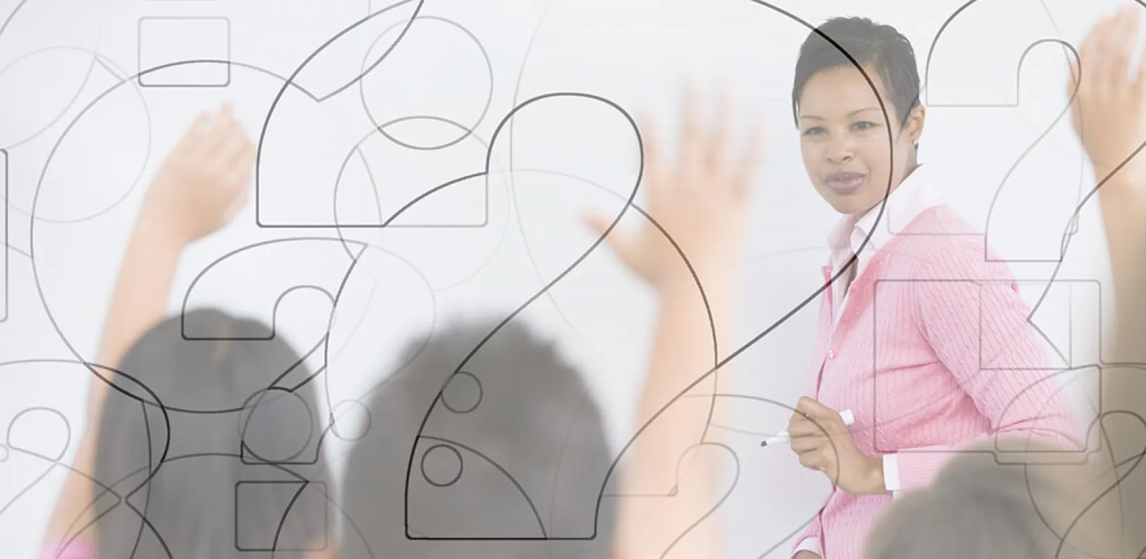 Educator at white board with overlaid question marks