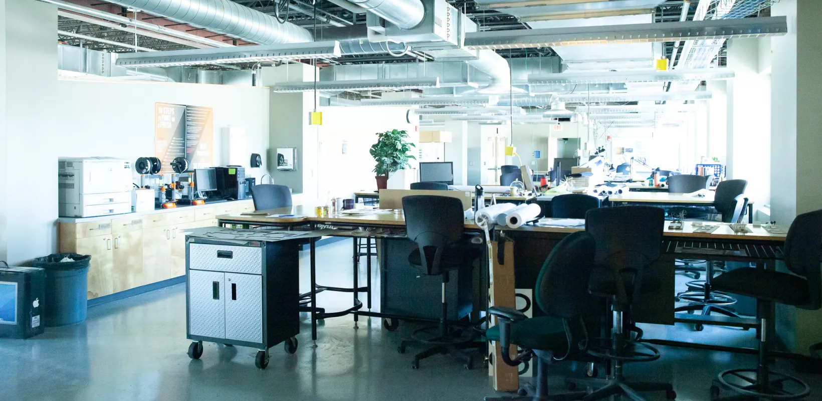 Classroom in Klai Hall with desks, chairs and equipment. 