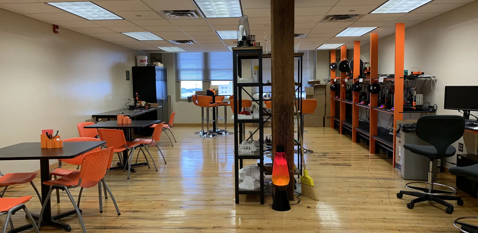 LAAVA classroom with tables, chairs, computers and other equipment.