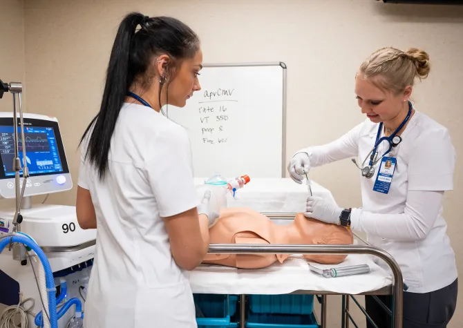 Respiratory Care students practicing procedures on a mannequin