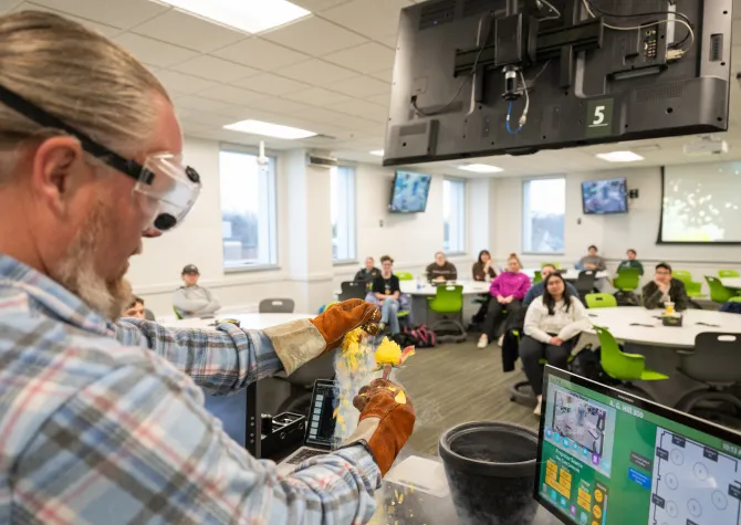 professor performing an experiment in class