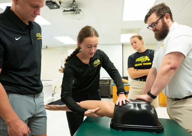 Athletic Training students get hands-on experience working on a special mannequin 