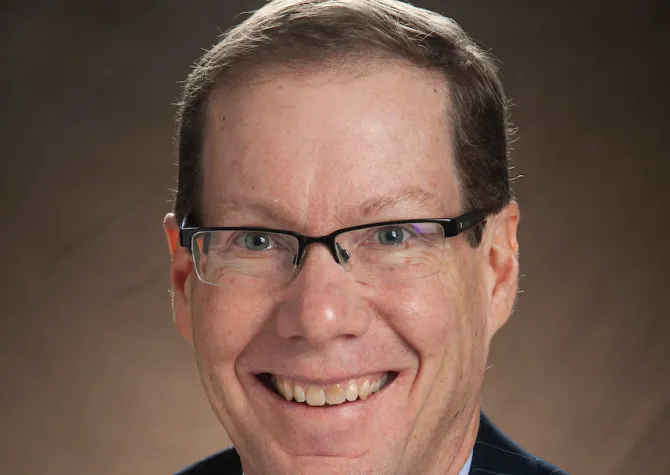 Headshot of Menard Family Director, John Bitzan, Ph.D.