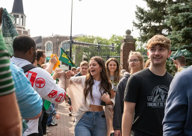campus volunteers lining up to welcome the new student class into the NDSU gates