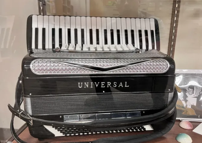 Lawrence Welk Accordian with black and white keys and black buttons
