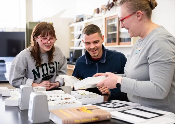 Professor and students in entomology lab