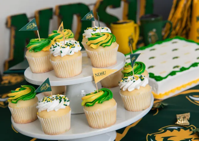 NDSU themed cupcakes with green and yellow decorations