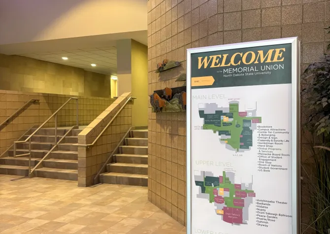 Memorial Union West Entrance interior with focus on building floor plan sign