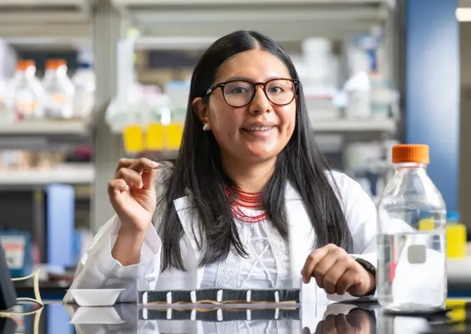 Student smiling in microbiology lab