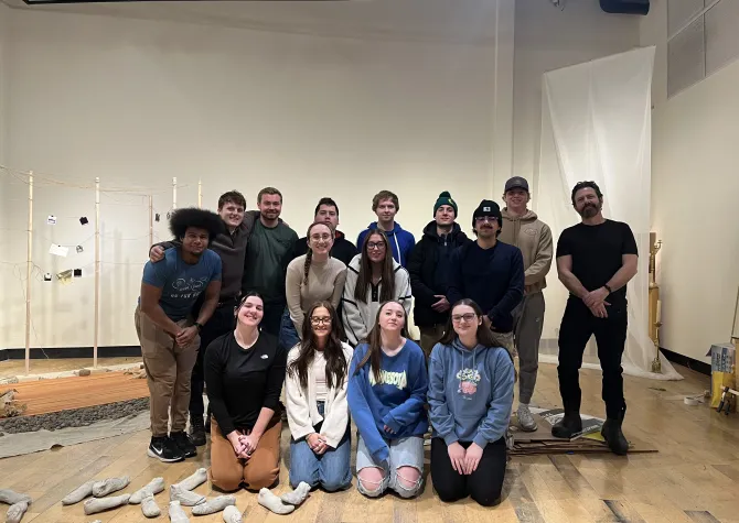 Image of the members of the Speculative Architecture class in front of their work