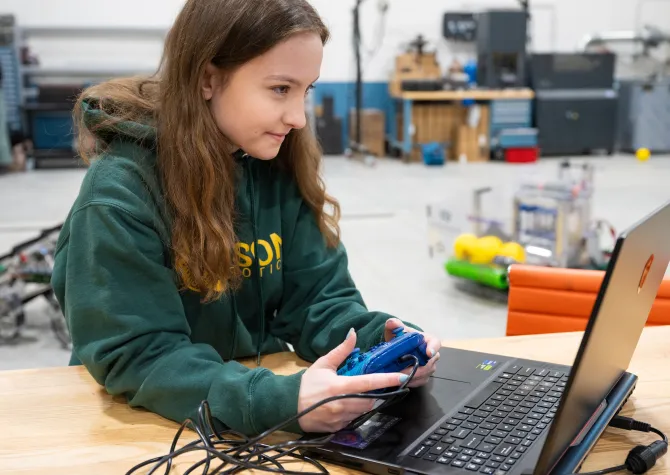 NDSU Software Engineering student Kaitlyn Nickel works on a robotics project