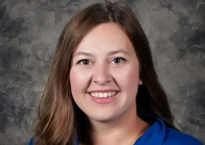 Megan Homuth smiling confidently at camera.