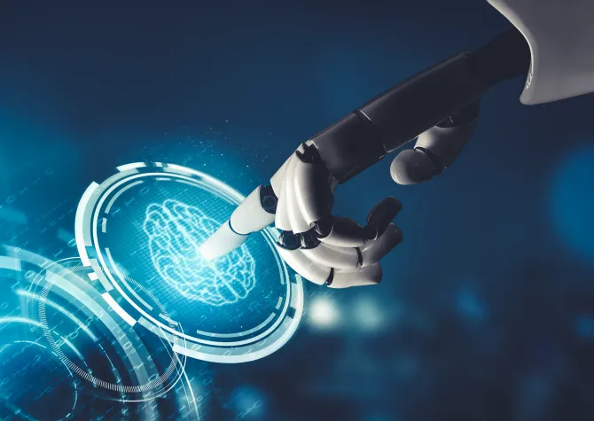 robot hand pointing at LED image of brain