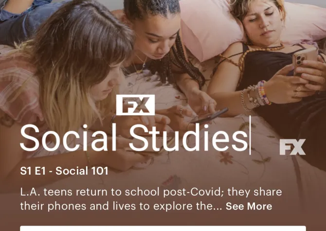 three young women looking at their cell phones