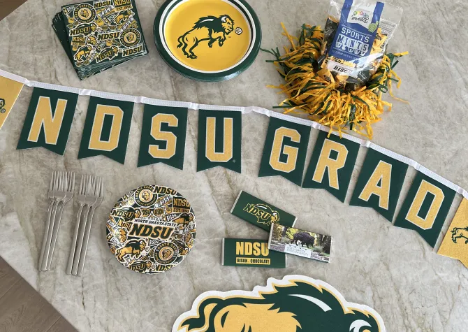 school themed graduation party supplies laid out on table