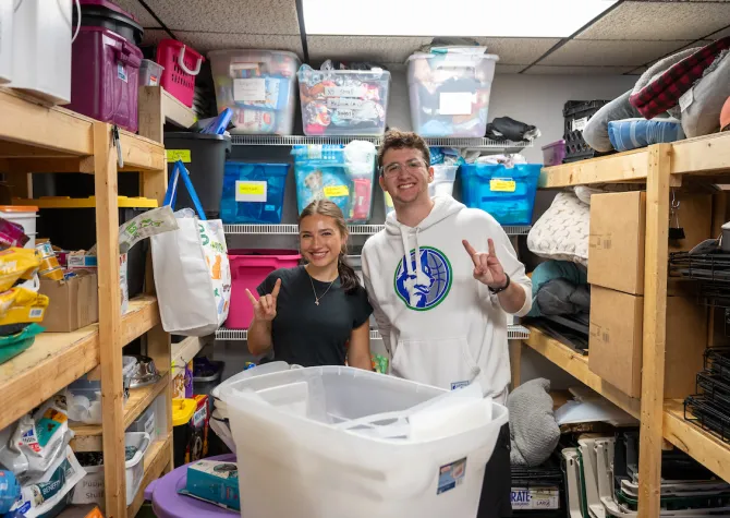 students clean and organize as part of Serve with the Herd